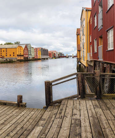 Colourful buildings along the river nidelva, in Trondheim, Norway.の写真素材