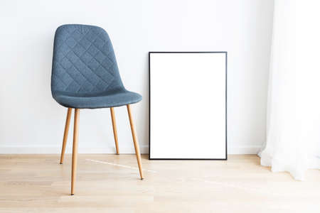 Modern interior with mockup frame and chair.の写真素材