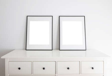 Empty frames for mock up, with white passepartout, standing portait mode.の写真素材