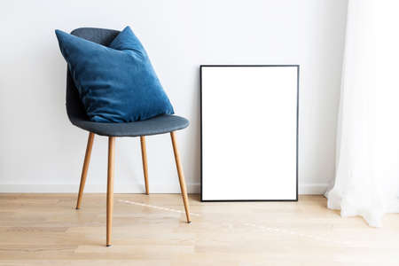 Modern interior with mockup frame and chair.の写真素材