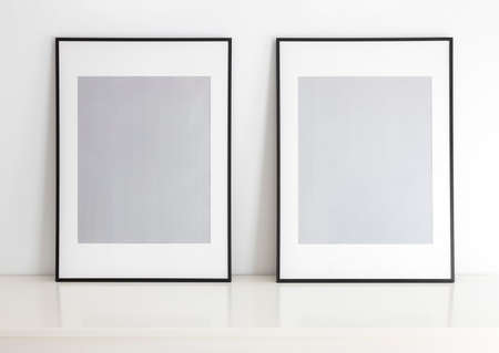 Empty frames for mock up, with white passepartout, standing portait mode.の写真素材