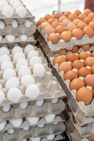Boxes of fresh farmers eggs stacked o top of each other.の写真素材