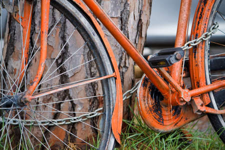 Old orange bike の写真素材