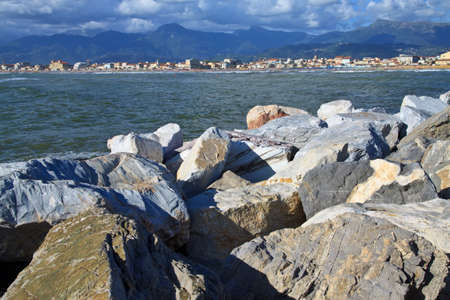 Group of rocks used as a defence against the sea in the port of viareggio の写真素材