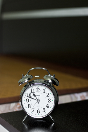 alarm clock on the tableのeditorial素材