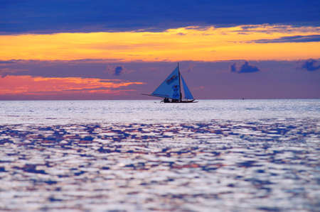 Yacht Sailing against sunset. Sailboat. Yachting. Sailing. Travel Concept. Vacationのeditorial素材