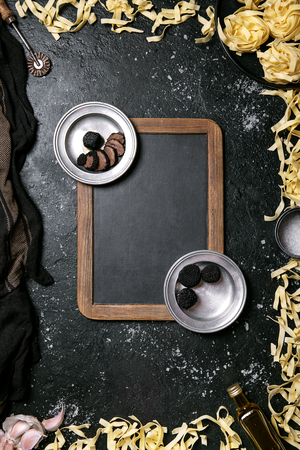 Home made egg pasta served with truffles, garlic truffle infused oil and salt. New concept of raw foods. Top View Copy Spaceの写真素材