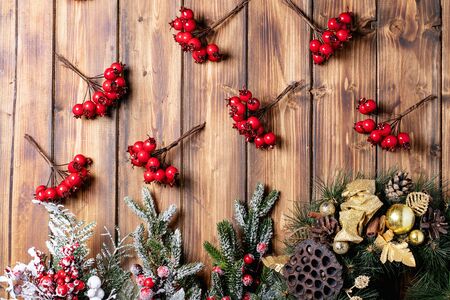 Traditional Christmas decorations over bright wooden background. Top view, flat lay. Copy spaceの写真素材