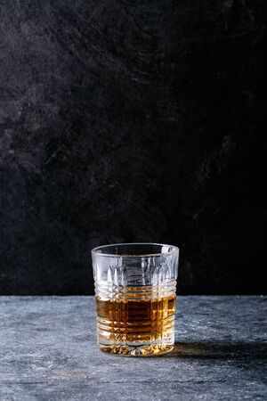 Glass of Irish whiskey over dark texture background. Copy spaceの写真素材