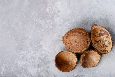 Coconut oil and milk over white texture background. Top view, flat lay. Copy space