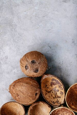 Coconut oil and milk over white texture background. Top view, flat lay. Copy spaceの写真素材