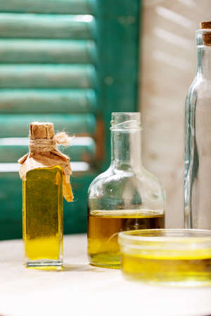 Olive oil in glass bottles over white murble background. Top view, flat lay. Copy spaceの写真素材