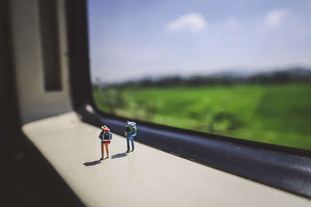 Miniature peoples went on vacation by trainの写真素材