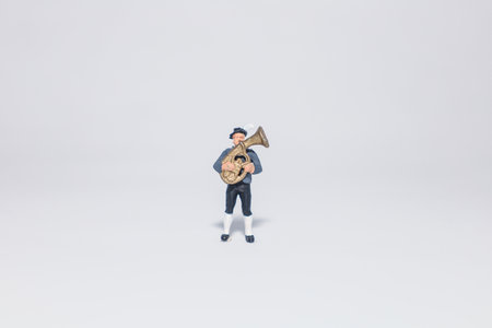 Miniature saxophone player , isolated on white backgroundの写真素材