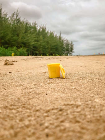 Miniature trash can at the beachの写真素材