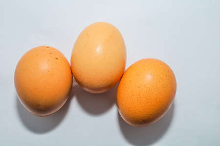 Top view fresh egg ready to cooked , isolated on white backgroundの写真素材