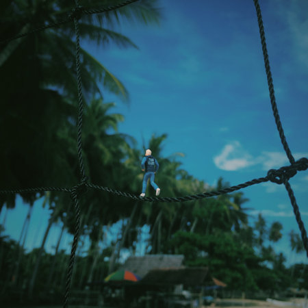 Miniature man on wire at the beach