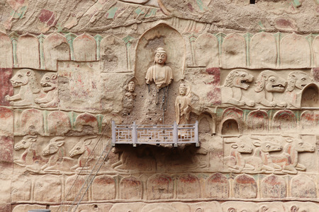 La Shao temple with giant 30-meter Buddha carved into rock at water Curtain Caves in Wushan, Gansu province, China.のeditorial素材