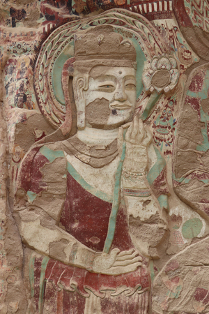 La Shao temple with giant 30-meter Buddha carved into rock at water Curtain Caves in Wushan, Gansu province, China.のeditorial素材