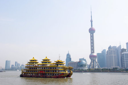 Dragon boat through the Shanghai skyline