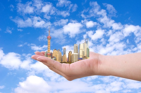 Placed in the hands of the Shanghai skylineの写真素材