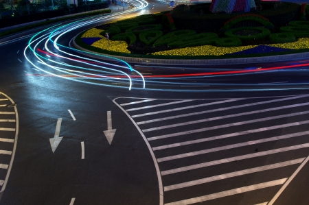Night in Shanghai, China, construction and traffic light trailsの写真素材