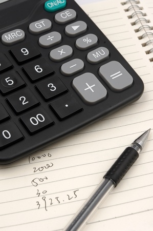 Calculator and penの写真素材