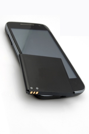 Closeup of cell phone and batteryの写真素材