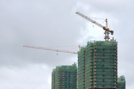 Building under construction, crane workの写真素材