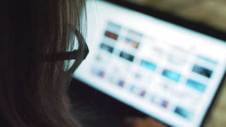 girl finishes his research of computer study. concept of perseverance, work from home , smart technology and connection to the web worldの写真素材