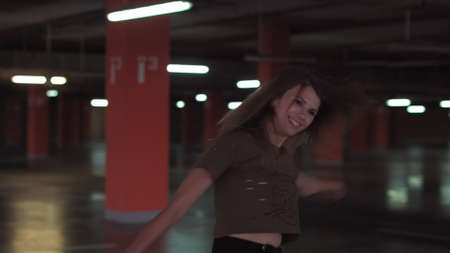 Funny overjoyed young woman winner jumping, dancing at celebrating mobile win concept. Euphoric girl student receiving sms message reading great news. Happy female customer excited about successの写真素材