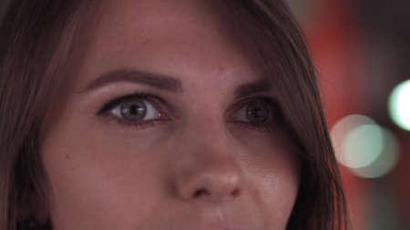 Close up of Womans Face, Girl opening her Beautiful green Eyes, Attractive Ginger. Natural Beauty . Gorgeous woman with long Eyelashes and Attractive Appearance. Slow motion.の写真素材