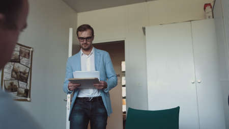 Two successful businessmen wear suits salesman banker manager handshake happy client customer investor at business meeting make bank loan insurance investment deal agreement shake hands sell servicesの写真素材