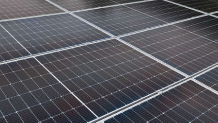Photovoltaic solar panel extreme close up. Close-up of modern photovoltaic solar battery panels. Solar panel, photovoltaic, alternative electricity source. Efficient ecological solar farm.の写真素材