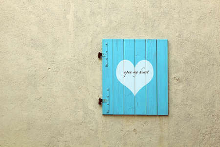 heart with text on a wooden shutterの写真素材
