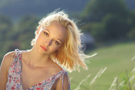 Young attractive woman in natureの写真素材