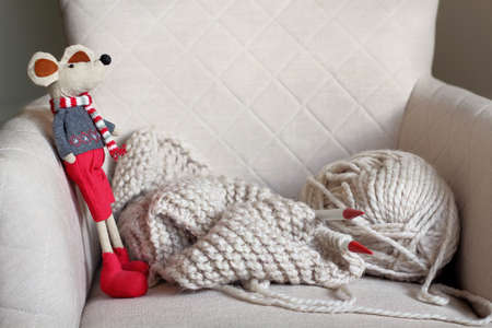 Home sweet home, handmade knitwear and toy on the stoolの写真素材