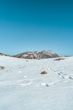 Wide vertical view from snow-capped Provincia hill towards San RamÃ³n hill, Chile.の写真素材