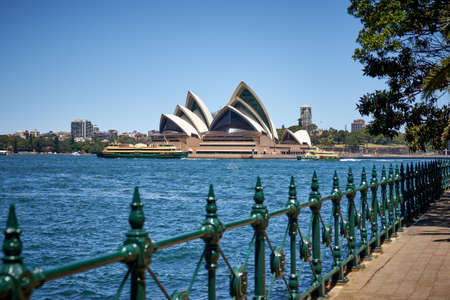 Iconic Sydney Opera house and ferries on the harbourのeditorial素材