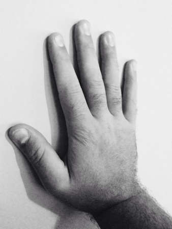 Mans hand on a wall.の素材