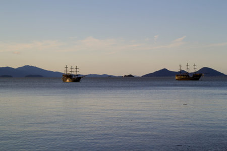 Photo of two tourist caravels in the middle of the oceanの写真素材