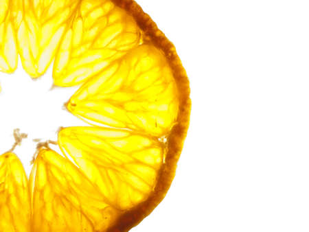 Closeup of a sliced up tangerine backlitの写真素材