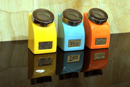 Sugar, tea and coffee pot displaying on tableの写真素材