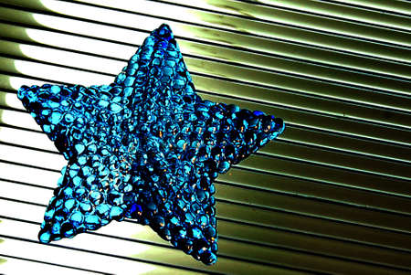 Blue crystal star with stripped backgroundの写真素材