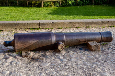 an old historic cannon barrel by the waysideの写真素材
