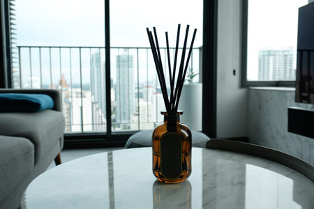 Oil diffuser on a marble table with an empty label