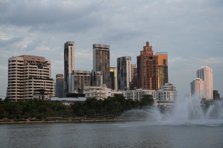 View of the skyline of Bangkok at sunset from a park in the heart of the Thai capitalの写真素材