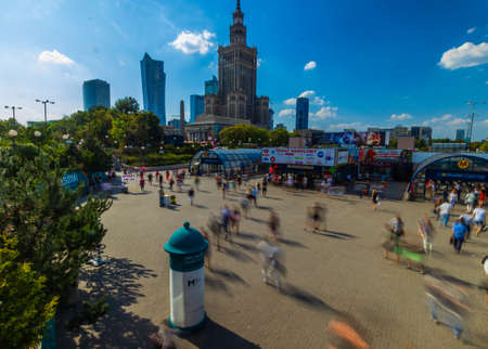 Warsaw, Poland. Palace of Culture with metro entrance and Science and downtown business skyscrapers, city center.のeditorial素材
