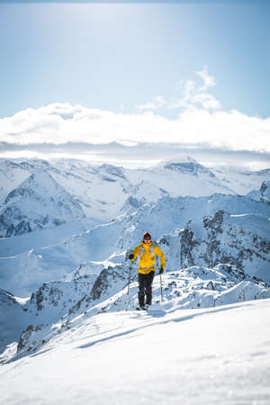 Austria, December 26 2018. Ski touring man in high alpine landscape with snowy trees. Ski touring in spectacular mountains in Tirol, Austriaのeditorial素材