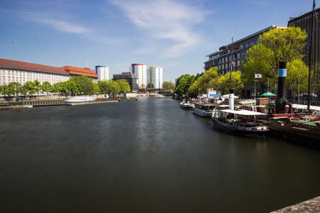 Old harbor with old ships at the riverside in Berlin, Germany. In The background is the berlin TV-Towerのeditorial素材